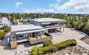 The home has water and street-facing decks.
